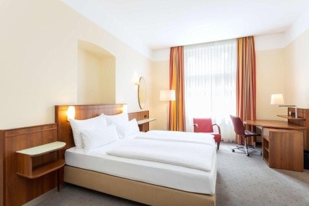 Stylový hotel NH Wien City Center v historické budově blízko zámku Belvedere.